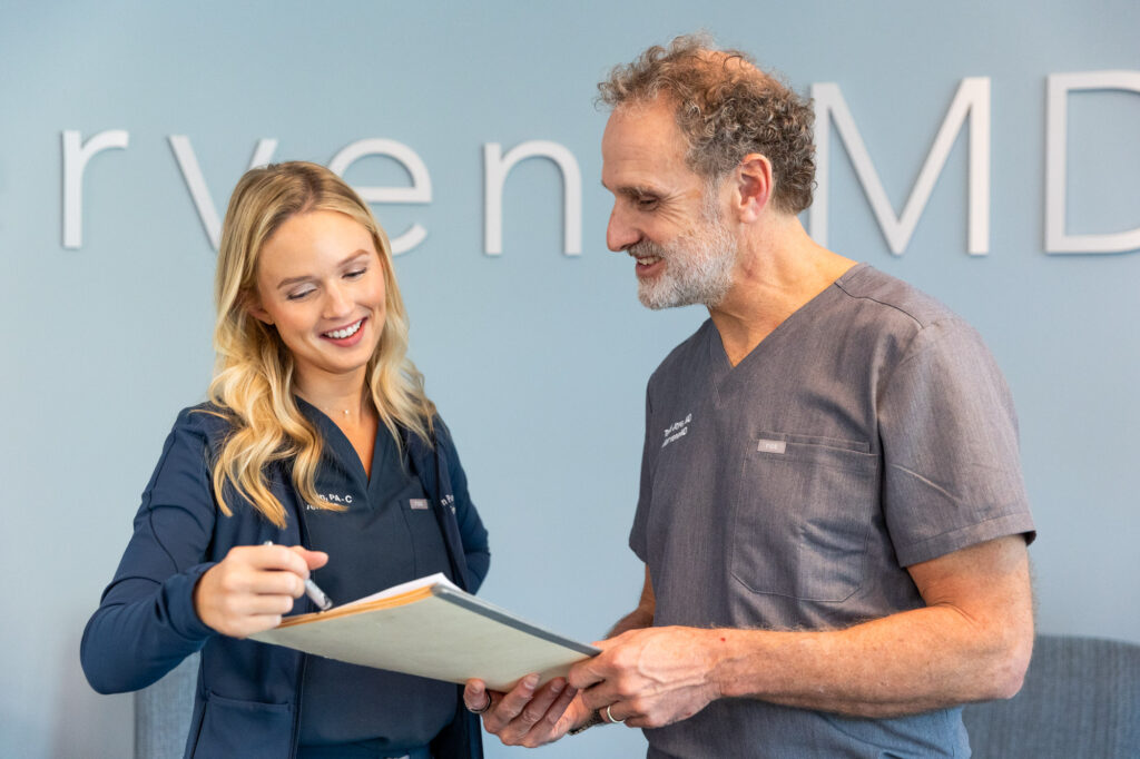 Two providers discuss a patient's plan at InterveneMD's weight loss clinic near Sullivan's Island, SC.
