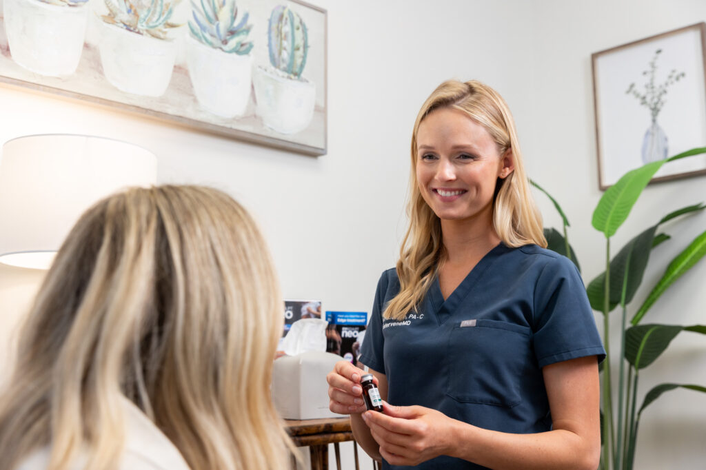 A patient sits down and discusses weight loss injections in Mt. Pleasant with an InterveneMD provider.