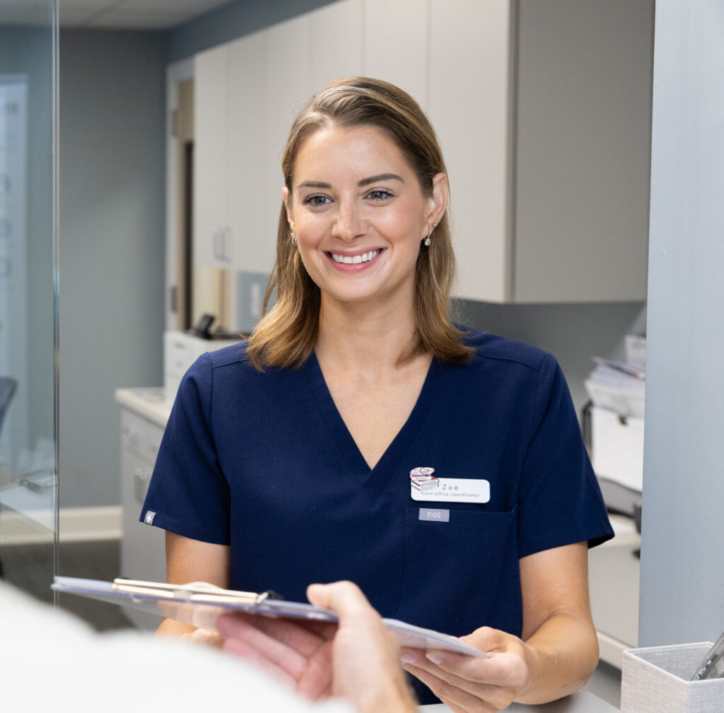 A InterveneMD provider is passing of a clipboard of information for a patient who has come in for dermaplaning in Mt. Pleasant.