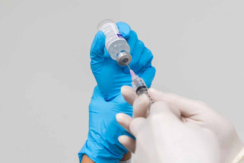 An InterveneMD medical expert is drawing up a needle for prolotherapy injections as a method of pain relief in Mt. Pleasant, SC.