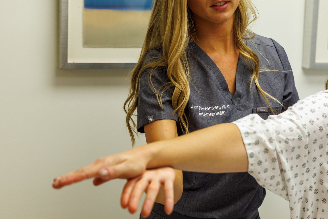 An InterveneMD provider evaluates a patient's physical health to better personalize their long COVID treatment in Charleston.