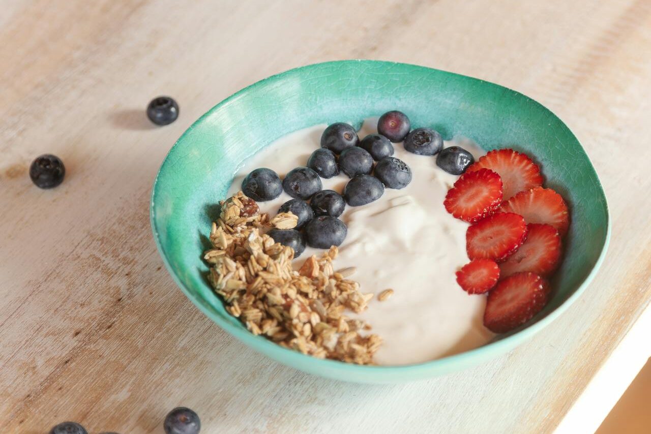 A bowl of yogurt is one of many dietary adaptations often recommended by our gut health doctor in Charleston.